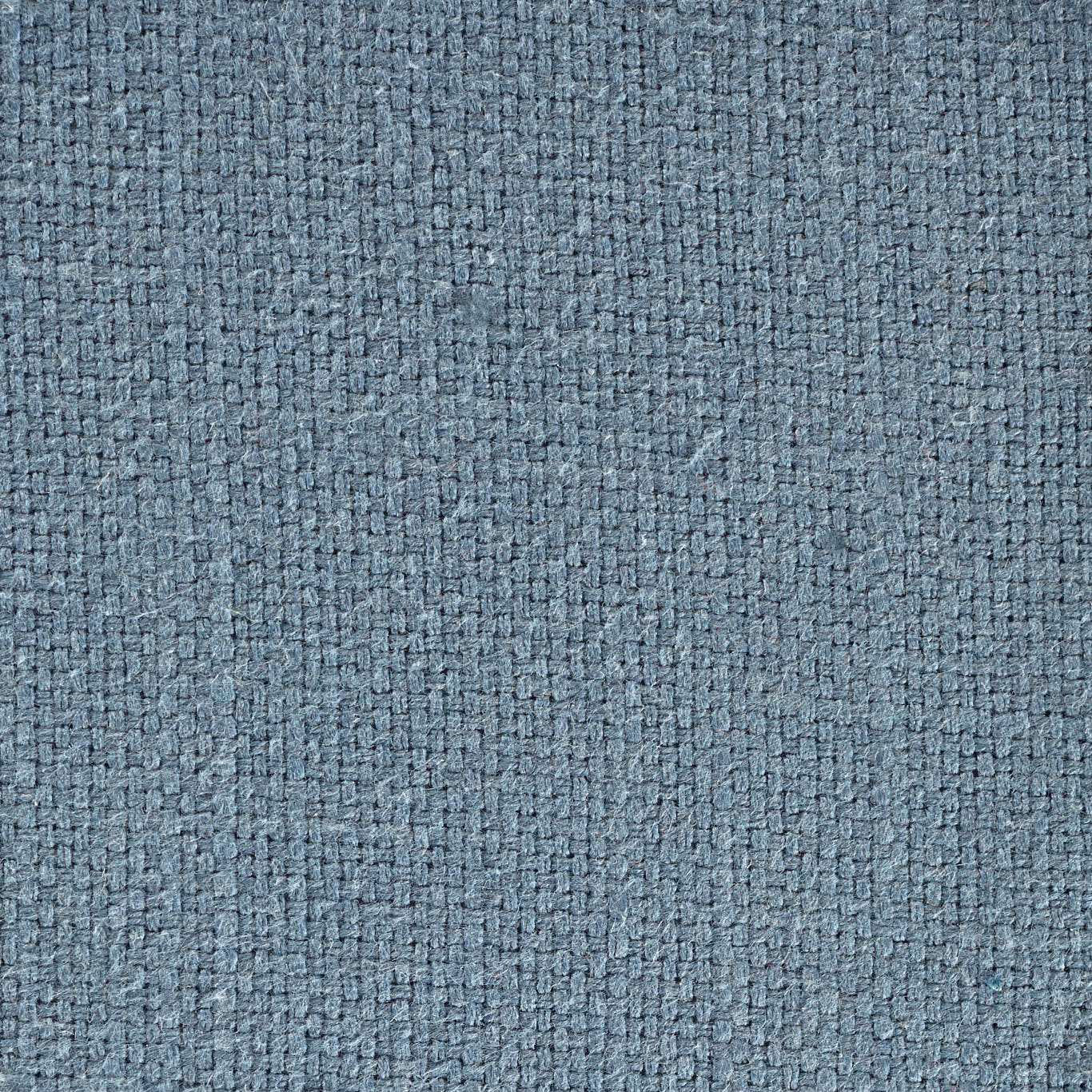 Close-up of a muted steel blue woven fabric with a tight textured surface