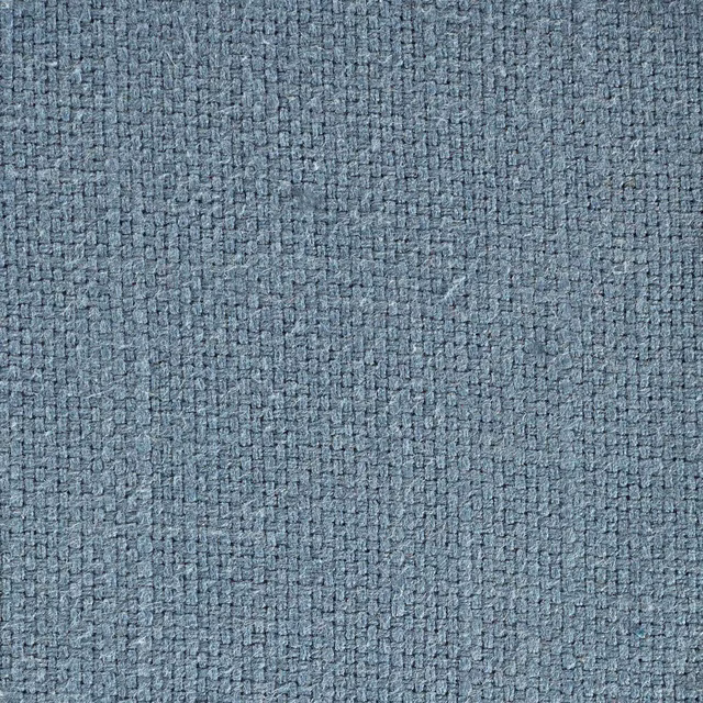 Close-up of a muted steel blue woven fabric with a tight textured surface