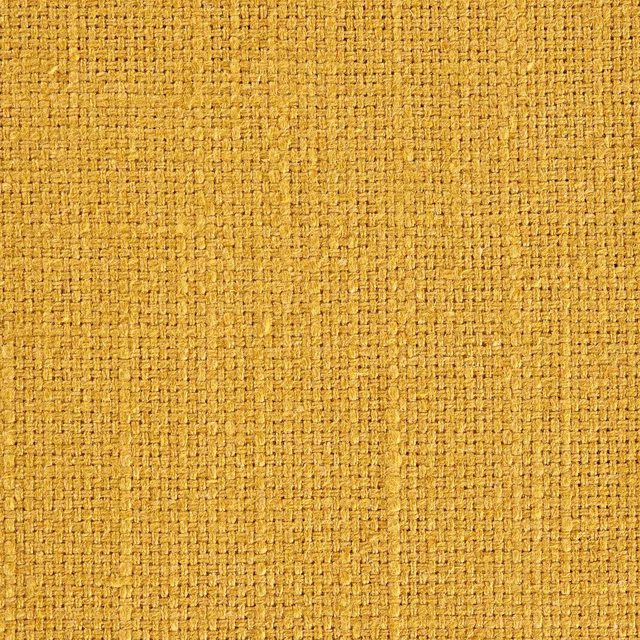 Close-up of turmeric-gold woven fabric with a tight textured basket weave