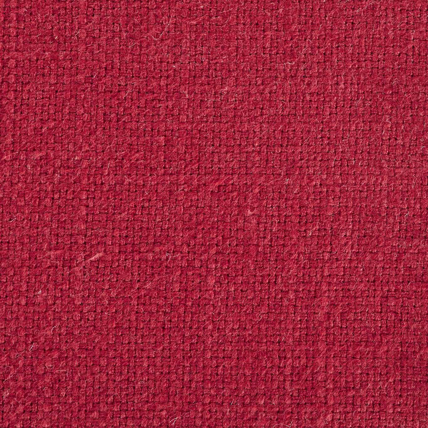 Close-up of a deep wine red woven fabric with a compact textured surface