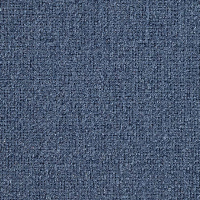 Close-up of muted indigo woven fabric with a tight textured surface