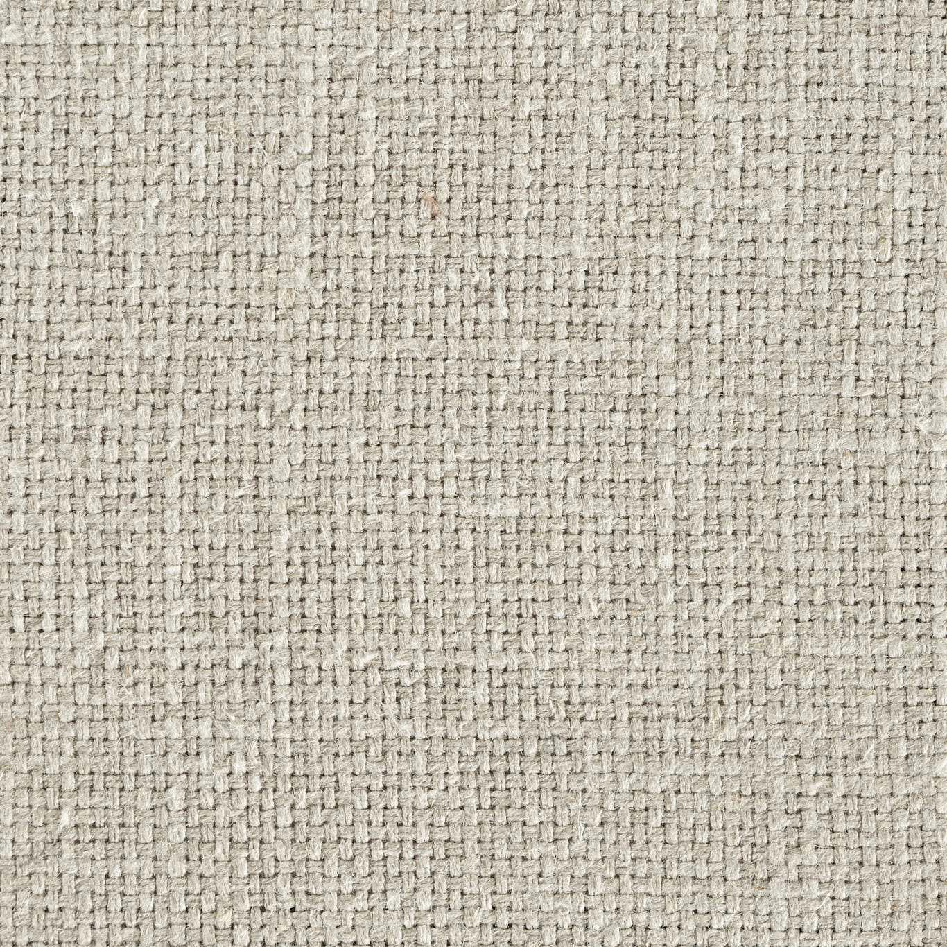 Close-up of warm pebble beige woven fabric with tight textured slub
