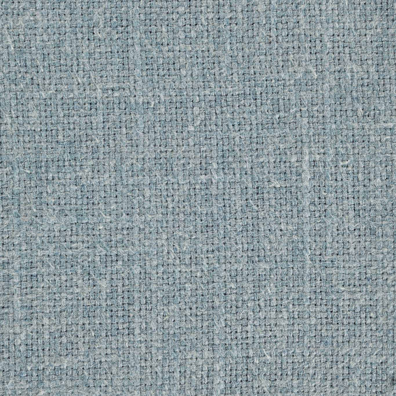 Close-up of softly textured pale teal woven fabric with a heathered finish