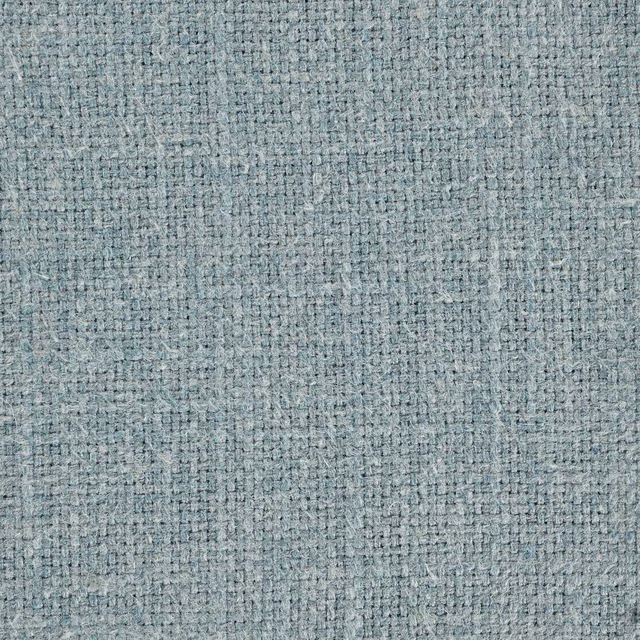 Close-up of softly textured pale teal woven fabric with a heathered finish