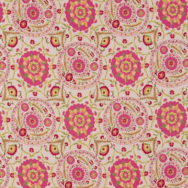 Large-scale cerise and lime floral medallion fabric on a cream ground