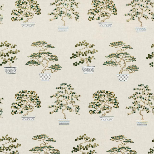Cream fabric swatch with scattered bonsai trees in scallion green and gold