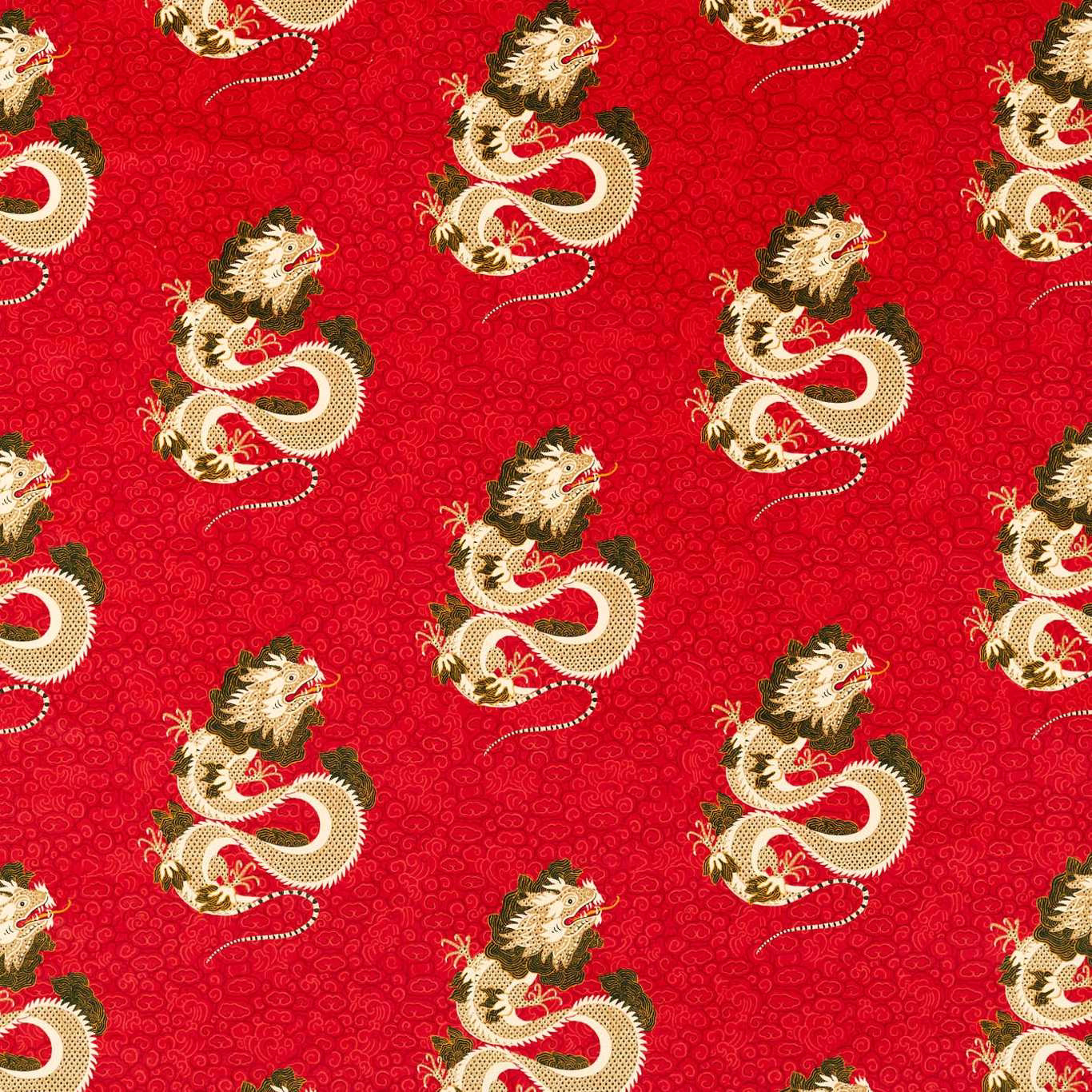 Red dragon-patterned fabric with cream and olive motifs on a dense woven ground