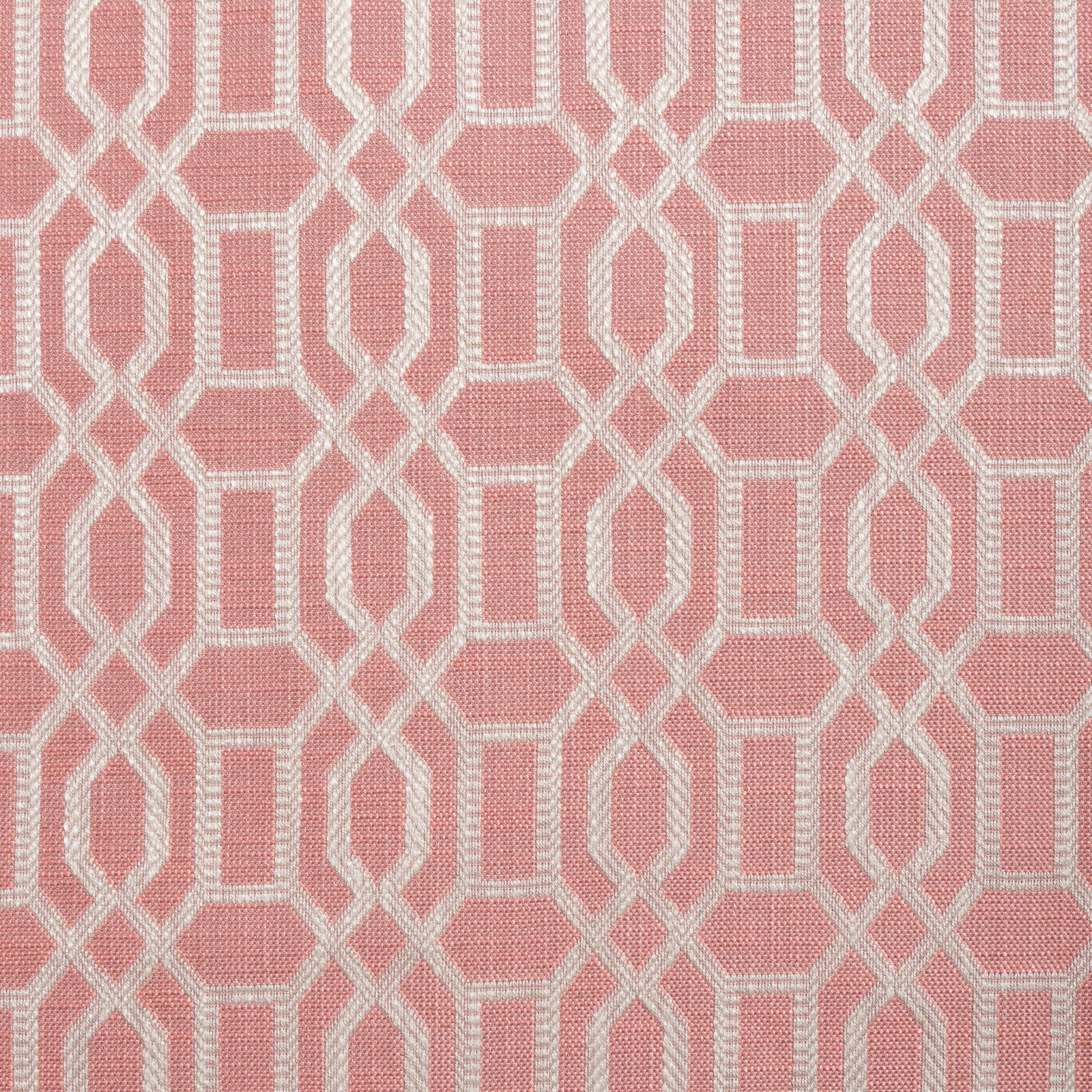 Warm coral-pink woven ground with ivory interlocking geometric trellis pattern