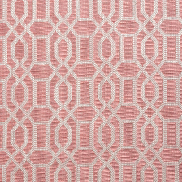 Warm coral-pink woven ground with ivory interlocking geometric trellis pattern