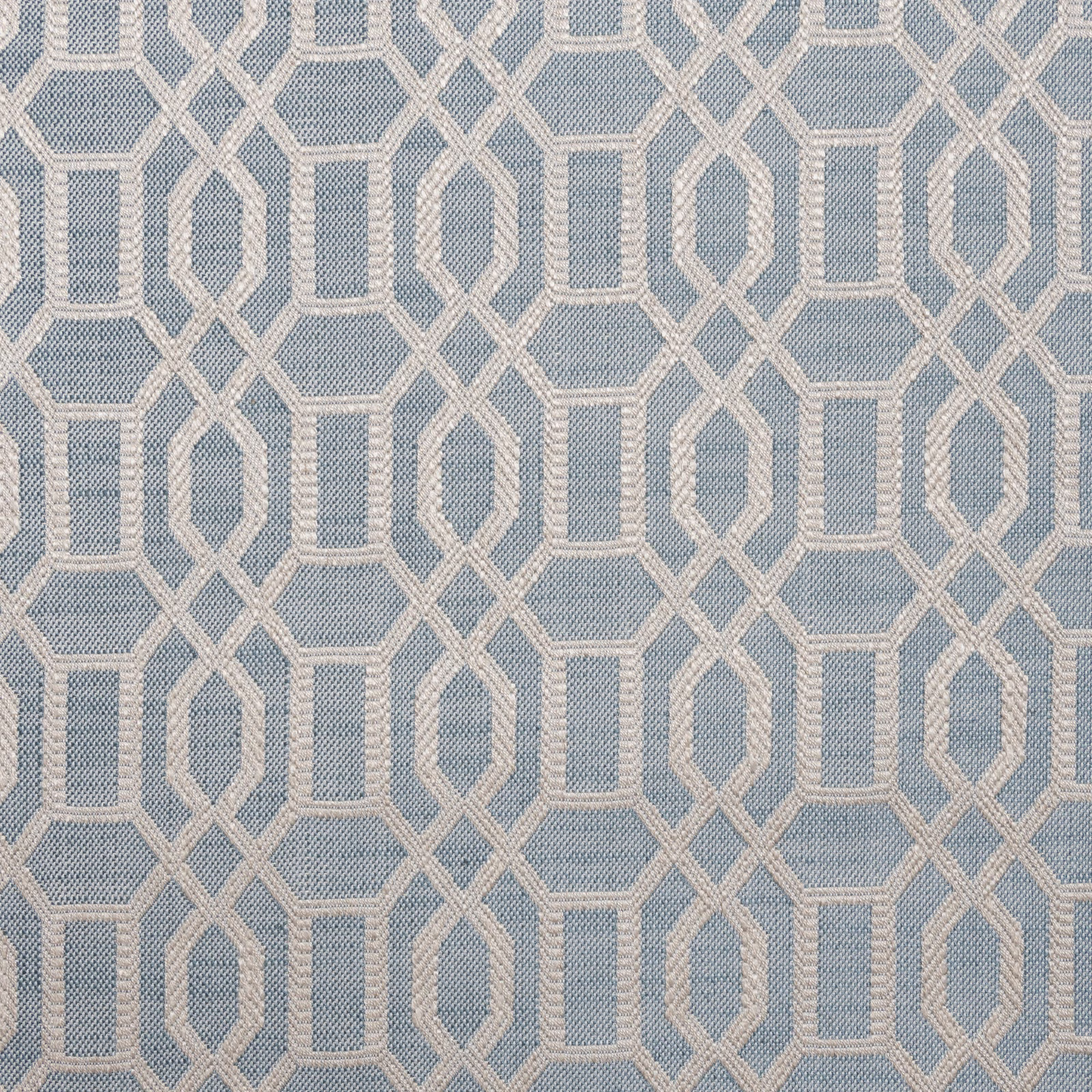 Muted ocean-blue woven ground with repeating ivory interlocking geometric outlines