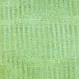 Close-up of mint green plain weave with pale yellow flecked texture
