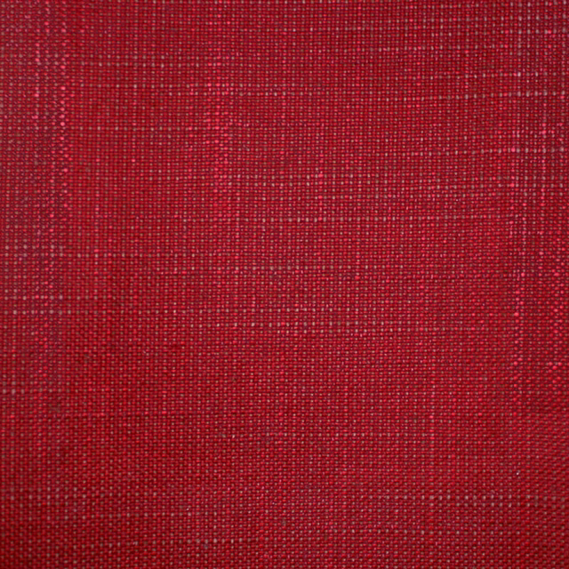 Close-up of deep crimson red fabric with a fine, irregular woven grid