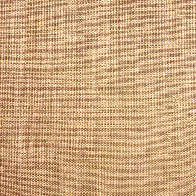 Close-up of warm camel-beige plain weave with a compact textured grid