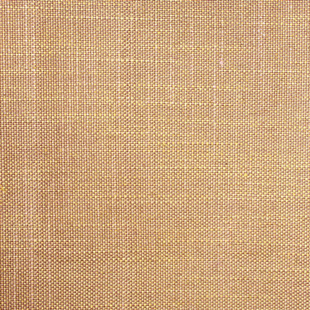 Close-up of warm camel-beige plain weave with a compact textured grid
