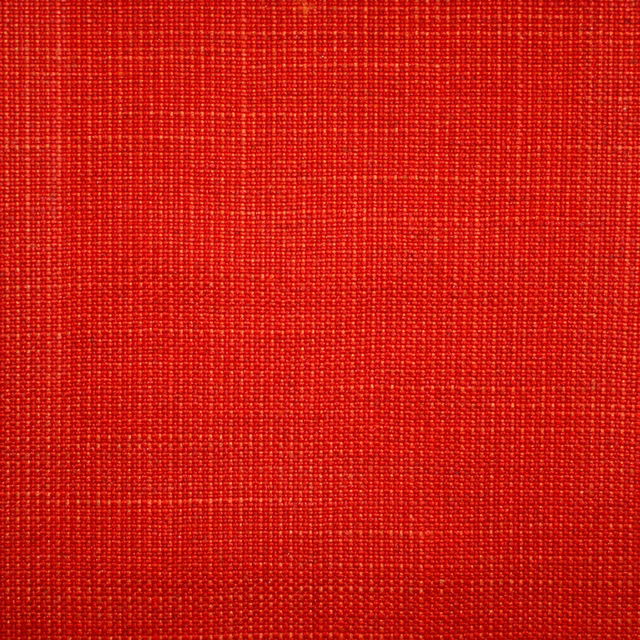 Close-up of vivid scarlet plain weave with fine, tactile horizontal and vertical texture.