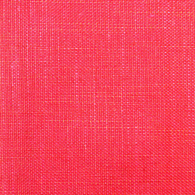 Bright watermelon-pink plain weave showing a fine, tactile crosshatched texture