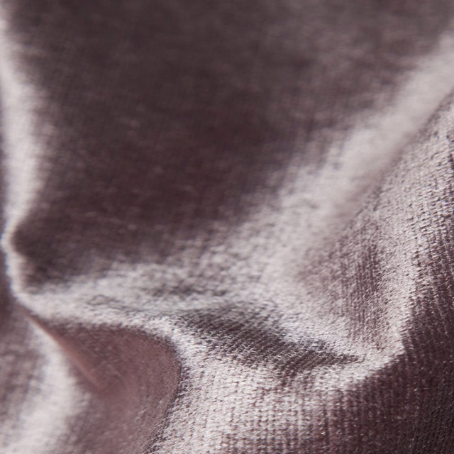 Smoky plum-brown woven textile with soft sheen gathered into sculptural folds