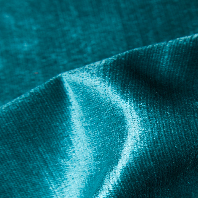 Deep teal Geo 19 fabric showing fine texture and turquoise directional highlights