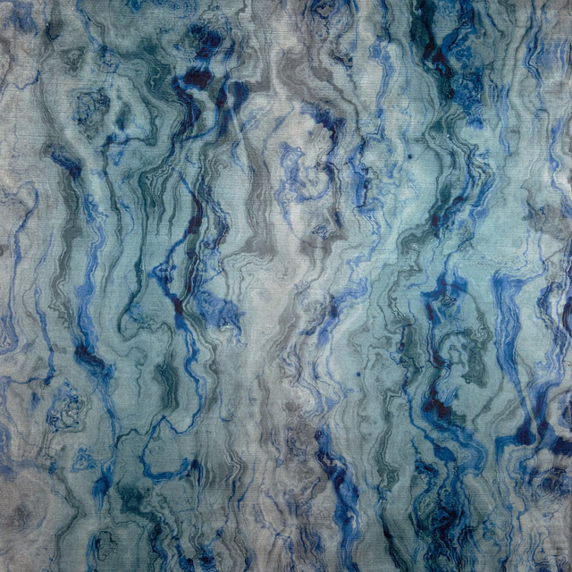 Blue-grey textile with flowing indigo marbling and fine vertical woven texture