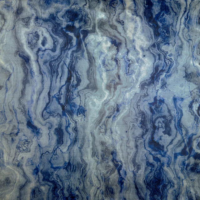 Blue-grey textile with flowing navy and pale mineral marbling
