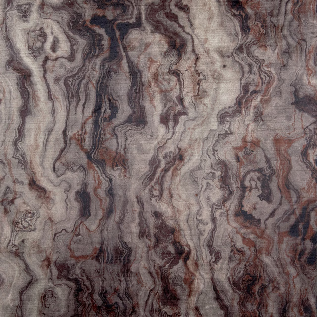 Smoky grey marble-effect textile with charcoal veins, taupe ribbons and muted rust accents