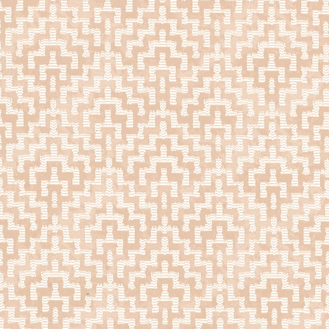 Warm sandy beige fabric with ivory stepped geometric motifs and subtle woven texture
