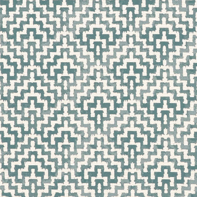 Muted teal and cream woven fabric with repeating stepped geometric motifs