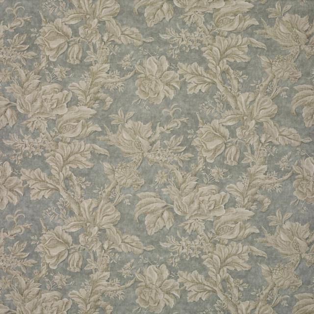 Muted blue-grey floral textile with ivory leaves and soft beige blossoms