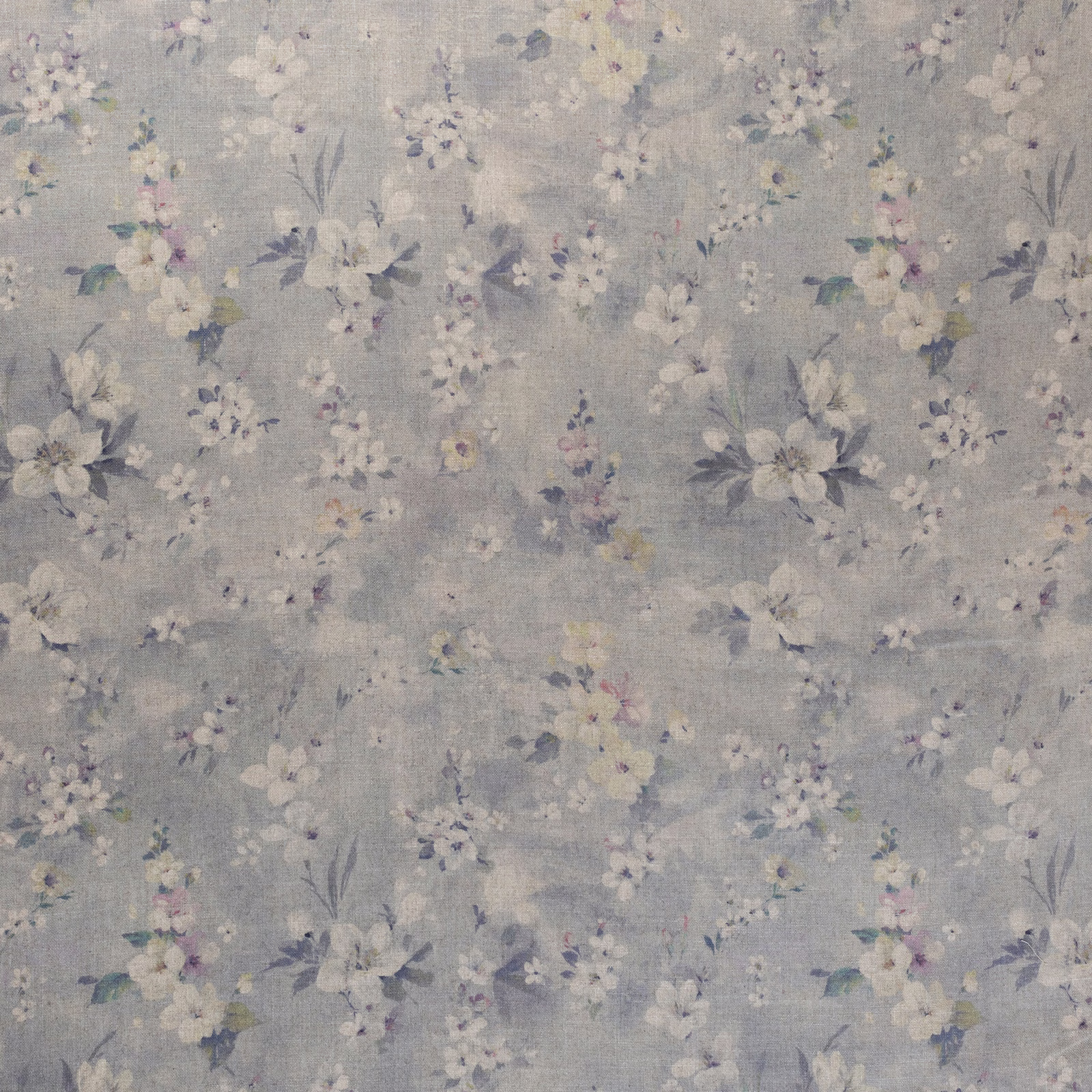 Cool blue-grey floral fabric with cream, lilac and dusty mauve scattered blooms