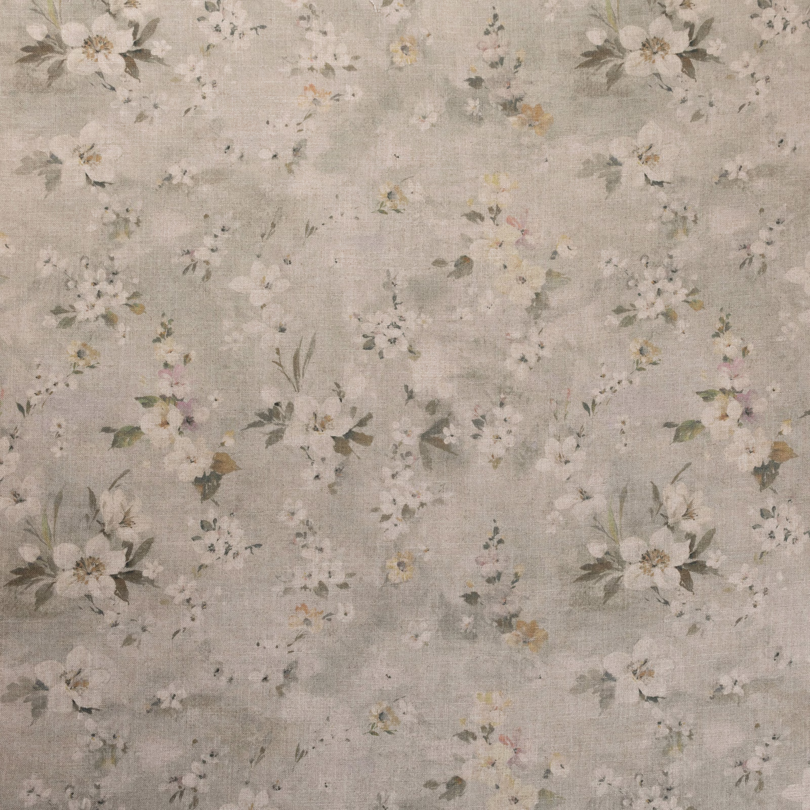 Pale pear-green textured ground with scattered ivory blooms and muted leafy sprigs