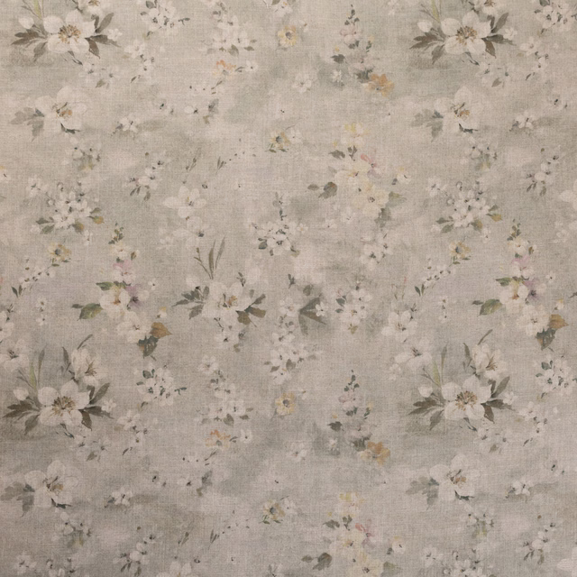 Pale pear-green textured ground with scattered ivory blooms and muted leafy sprigs