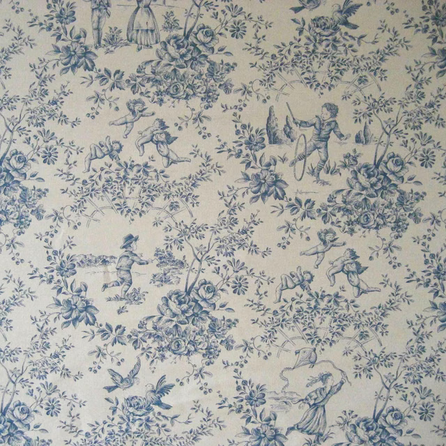 Warm ivory toile fabric with muted blue flowers, birds, figures and pastoral scenes