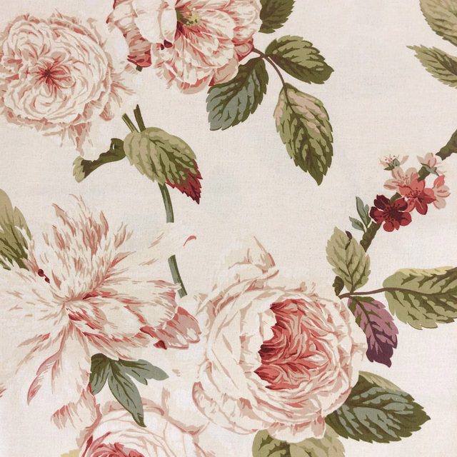 Blush peonies, coral flowers and olive leaves on a warm ivory floral textile