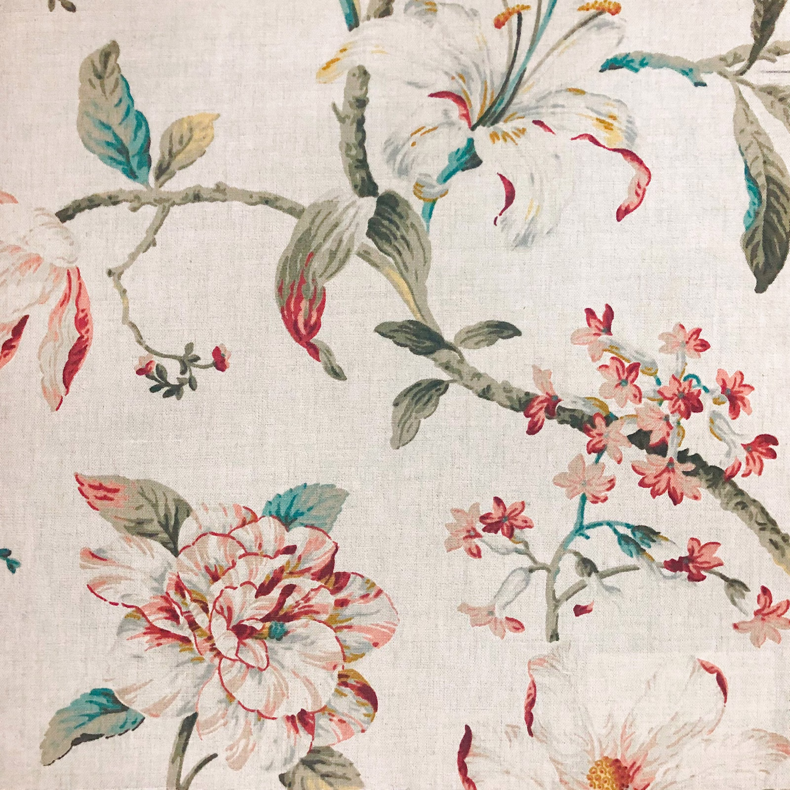 Ivory floral fabric with teal leaves, coral blooms and fine woven texture