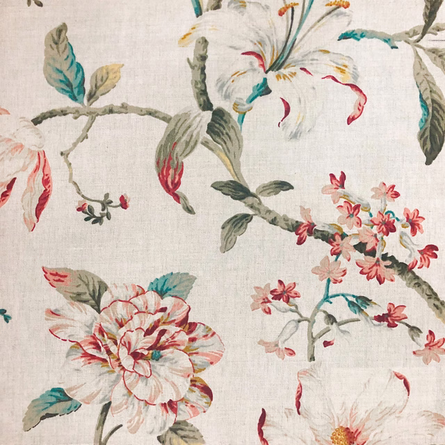 Ivory floral fabric with teal leaves, coral blooms and fine woven texture