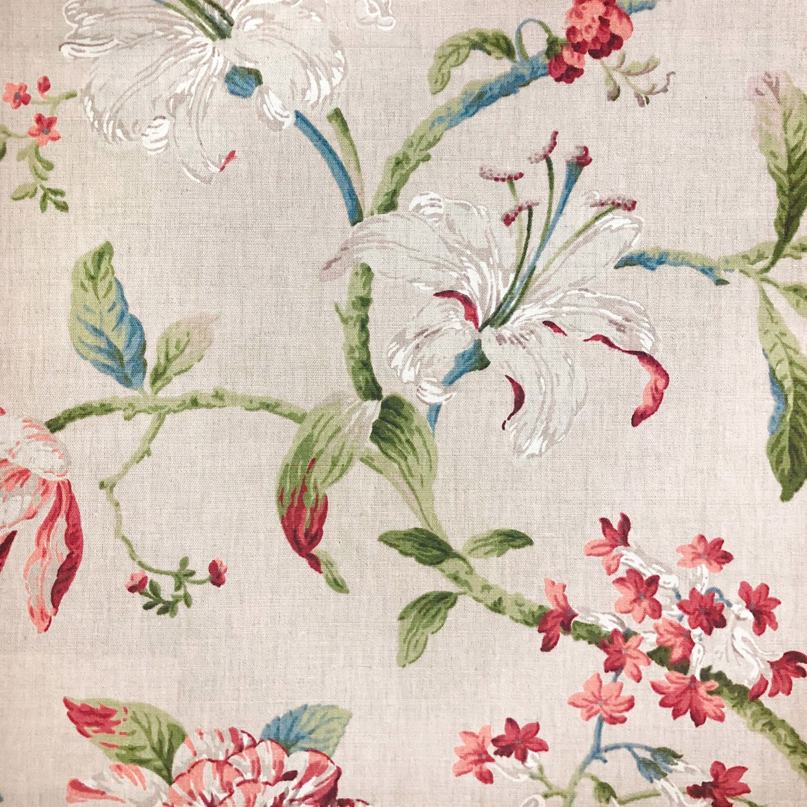 Natural woven ground with white lilies, red blossoms, blue leaves and green stems