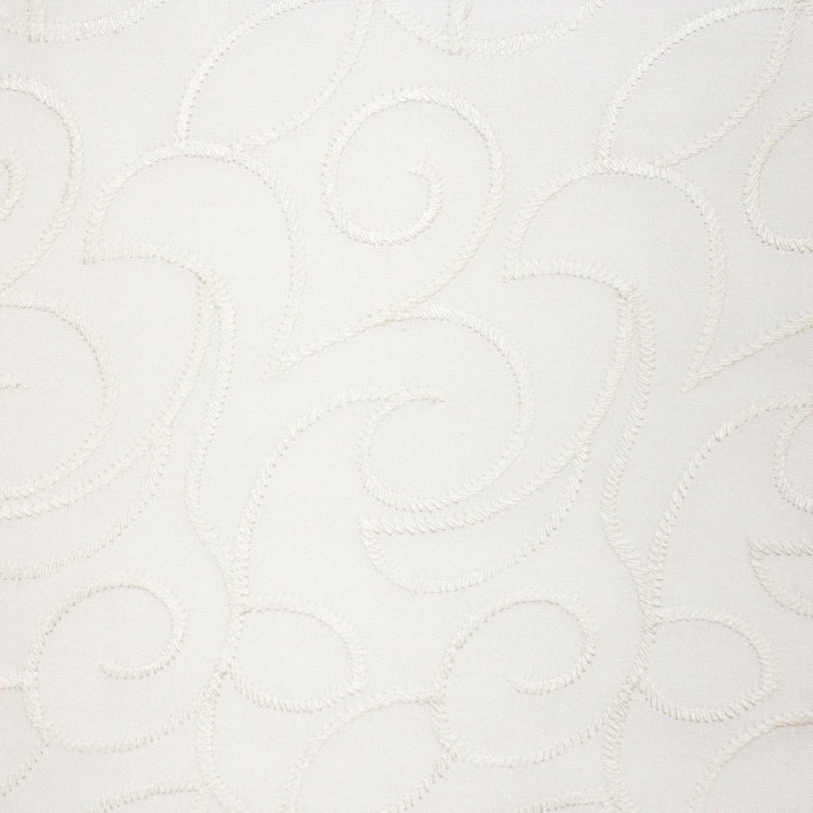 Ivory white fabric with raised scrolling embroidery and softly tactile stitching
