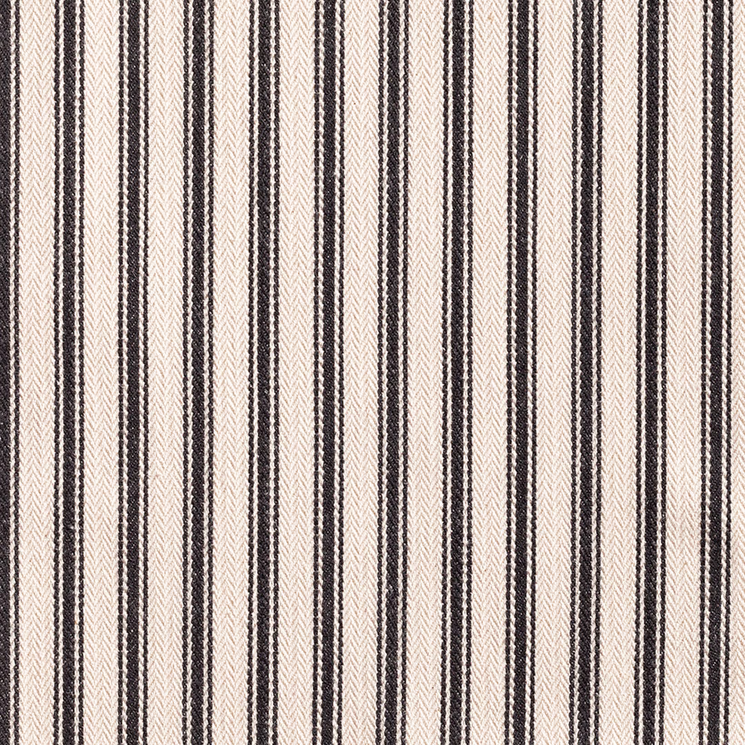 Warm cream woven ticking with narrow black vertical stripes and textured edges