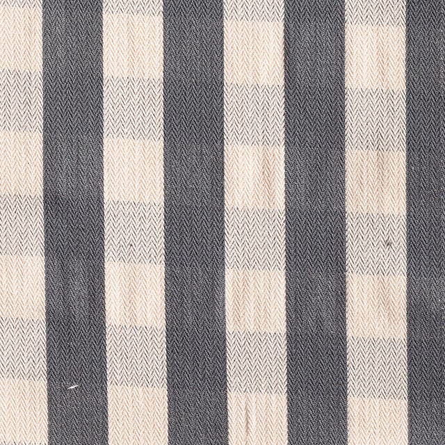 Charcoal and ivory checked fabric with a fine herringbone weave