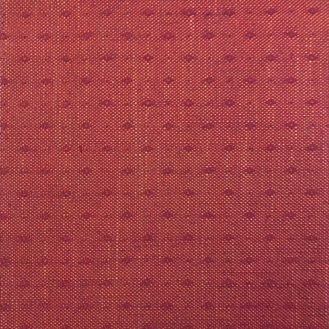 Muted brick-red woven ground with rows of tiny burgundy horizontal marks