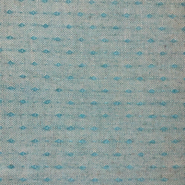 Grey-beige woven ground with scattered turquoise dash motifs