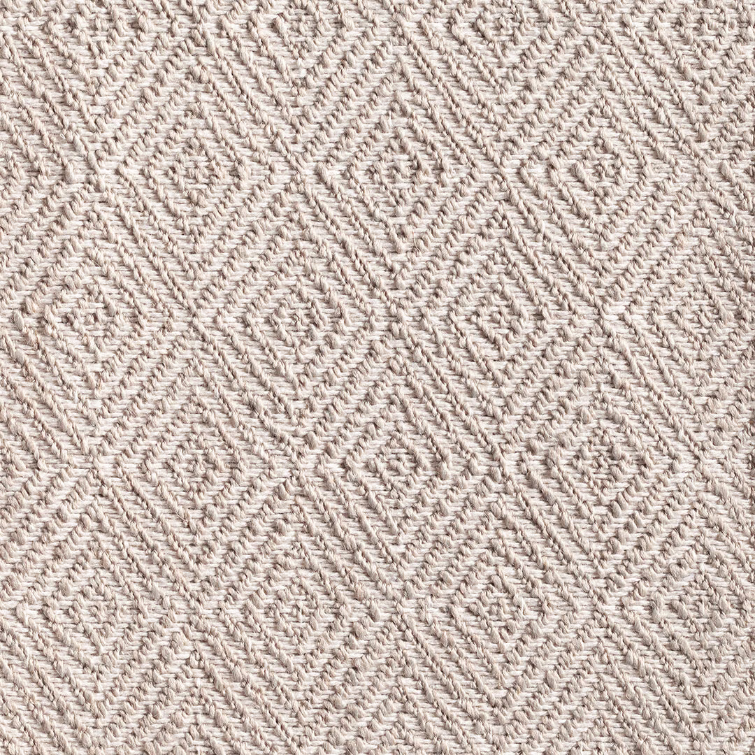 Pale silver-greige woven textile with raised chevrons and linked diamond texture