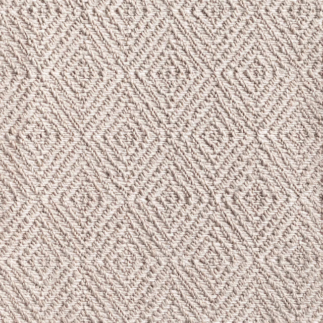 Pale silver-greige woven textile with raised chevrons and linked diamond texture