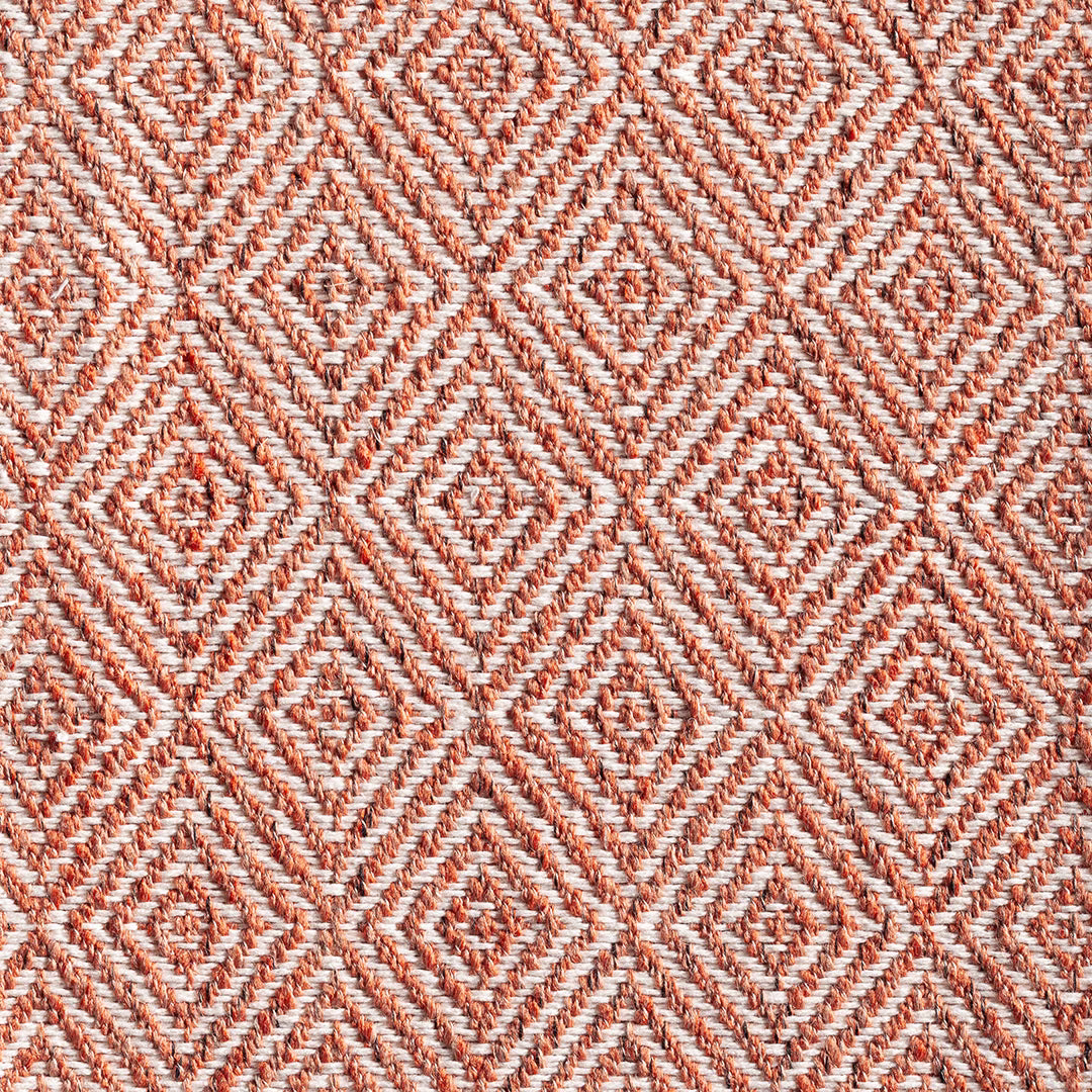 Warm chestnut and ivory woven textile with repeating concentric diamond motifs