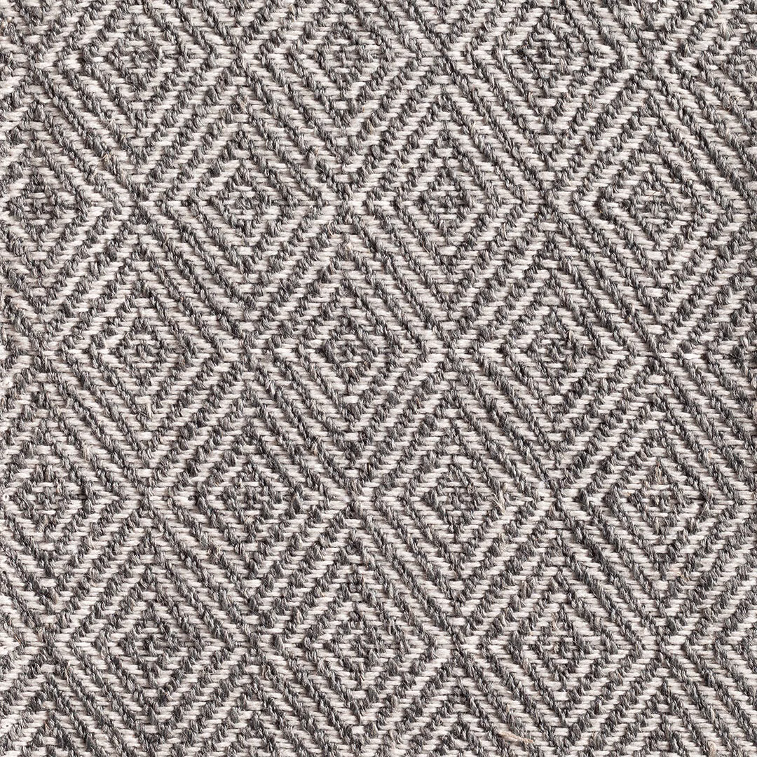 Cool grey and cream woven fabric with repeating textured diamond motifs