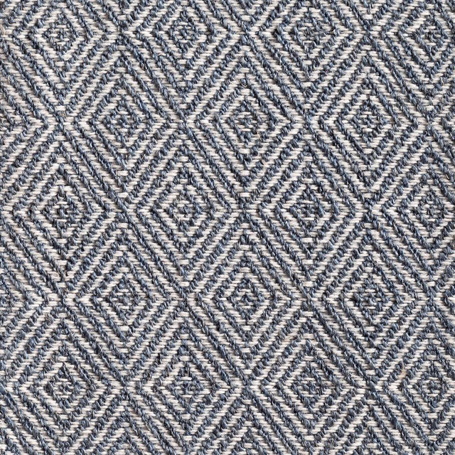 Ink-blue and cream woven fabric with tactile interlocking diamond motifs