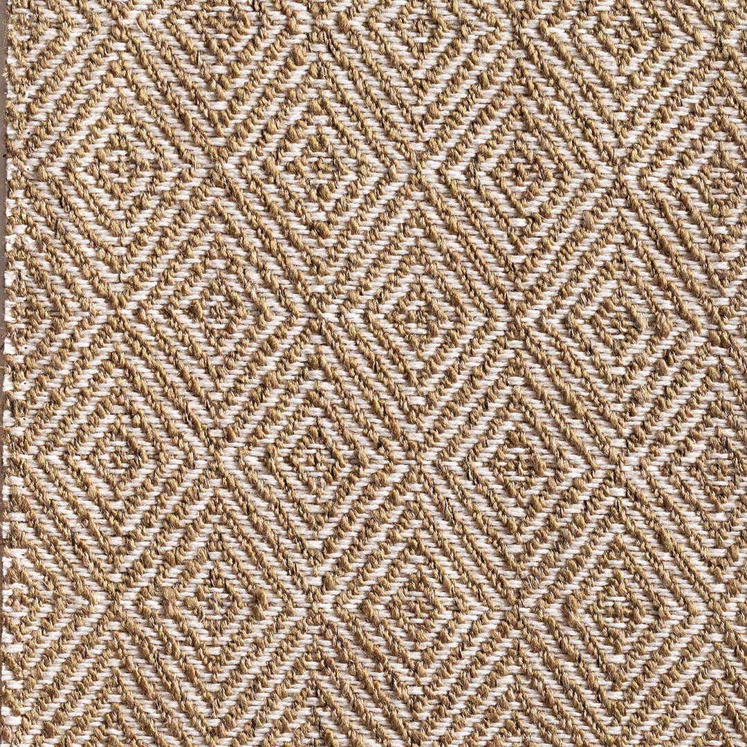 Warm oat fabric with muted matcha threads in a raised broken-chevron geometric weave