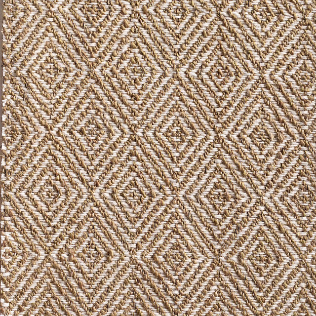 Warm oat fabric with muted matcha threads in a raised broken-chevron geometric weave