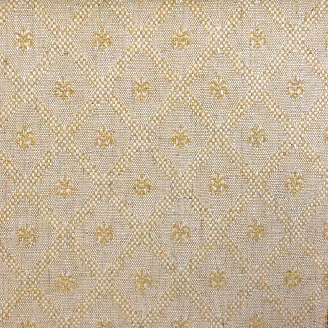 Warm beige woven fabric with muted gold diamond lattice and tiny motifs