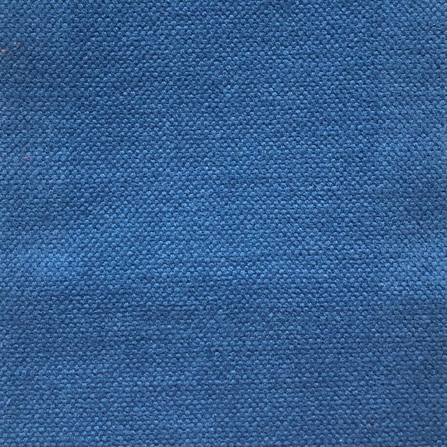 Close-up of Duo 104 showing dense pebbled weave in deep mottled blue